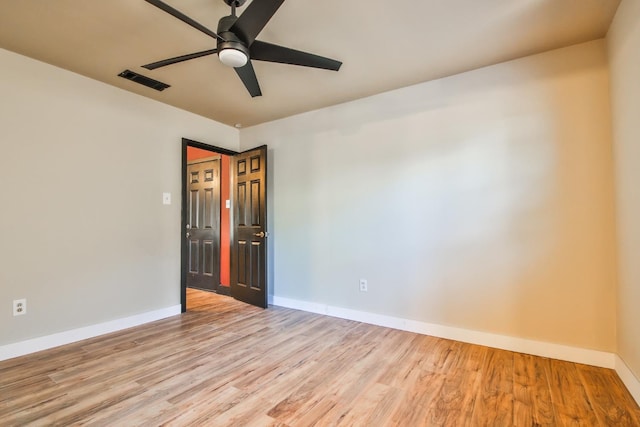 unfurnished room featuring light hardwood / wood-style flooring and ceiling fan