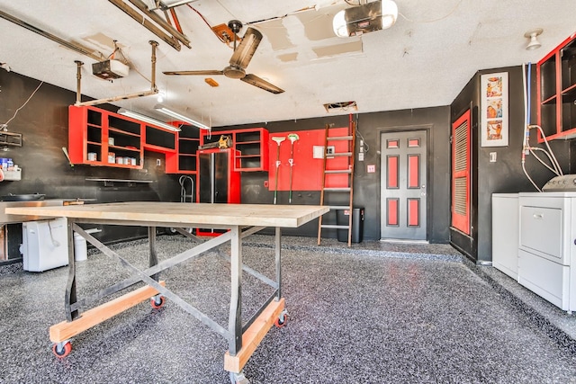 interior space with ceiling fan, independent washer and dryer, and a workshop area