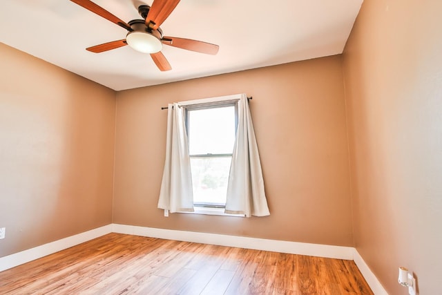 empty room featuring ceiling fan and light wood-type flooring