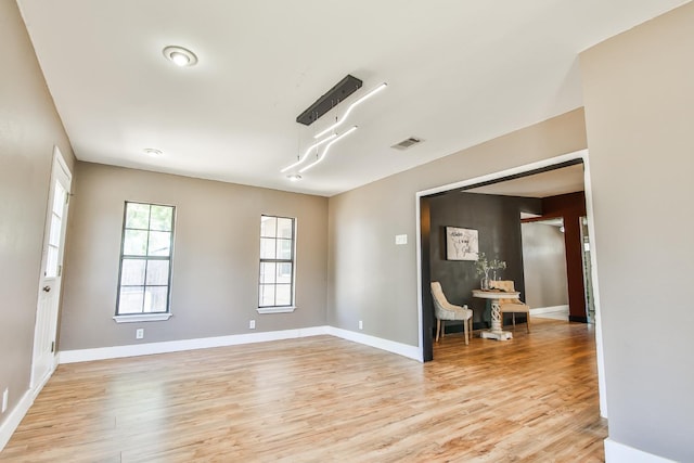 spare room with light wood-type flooring