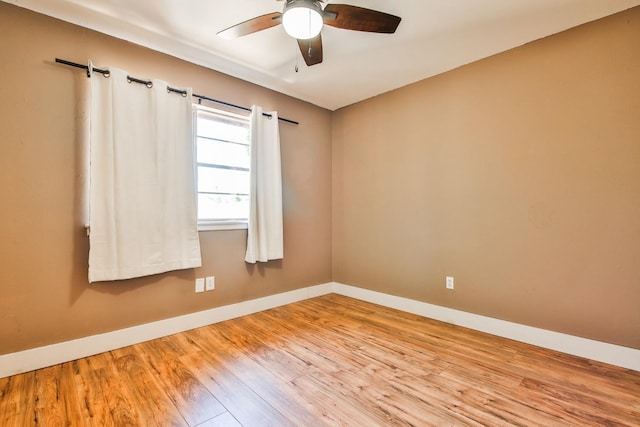 unfurnished room with ceiling fan and light hardwood / wood-style floors