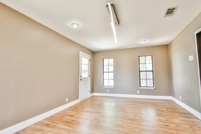 empty room with light hardwood / wood-style floors