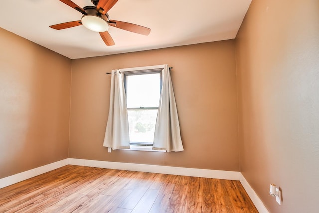 spare room featuring ceiling fan and light hardwood / wood-style flooring