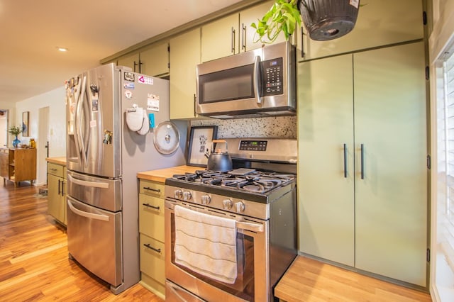 kitchen featuring appliances with stainless steel finishes and light wood-type flooring