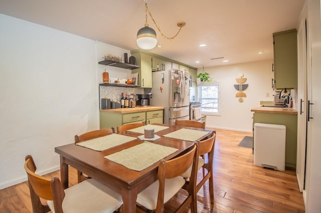 dining area with light hardwood / wood-style floors