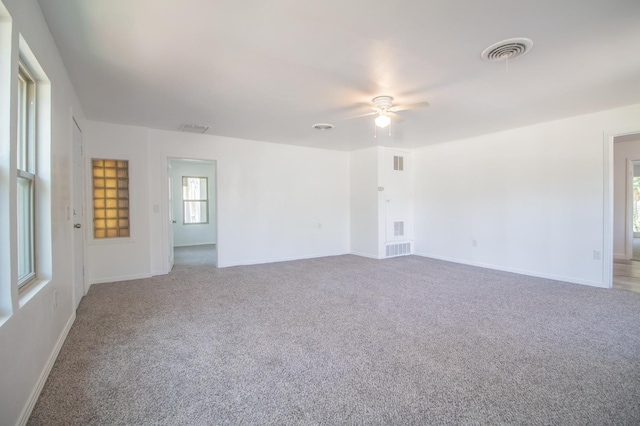 carpeted empty room with ceiling fan