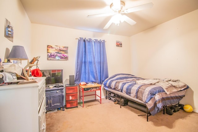 bedroom featuring light colored carpet and ceiling fan