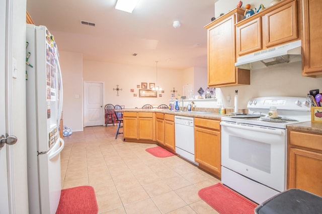 kitchen with pendant lighting, white appliances, kitchen peninsula, and light tile patterned floors