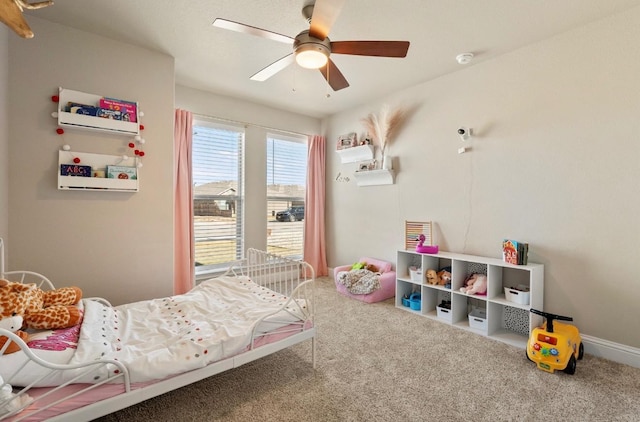 bedroom with ceiling fan and carpet