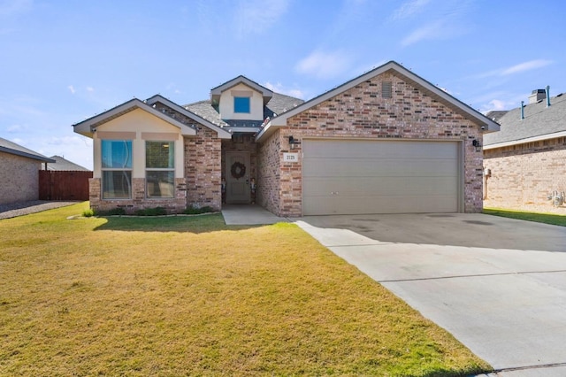 view of front of house with a garage and a front yard