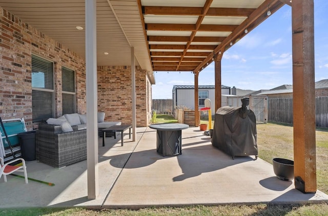 view of patio / terrace featuring an outdoor hangout area and a storage shed