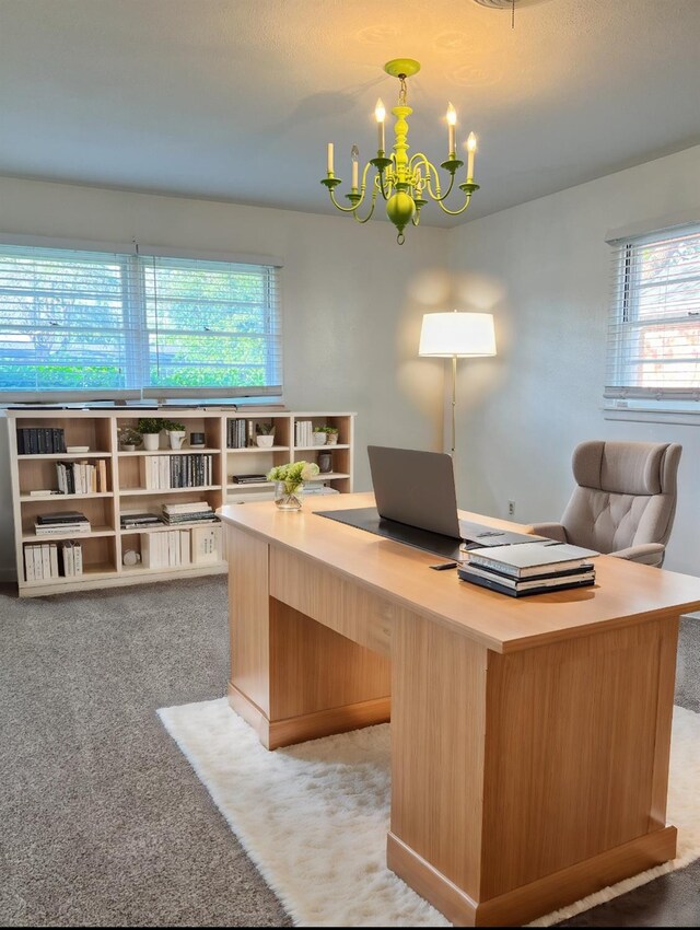 office space featuring an inviting chandelier, light carpet, and a wealth of natural light