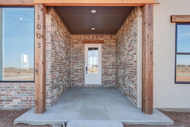 doorway to property featuring a patio area