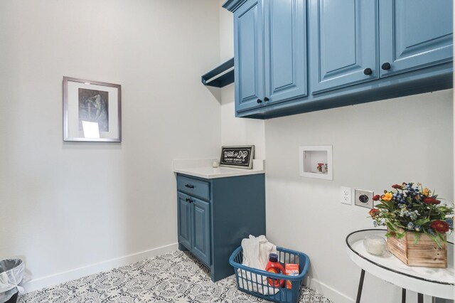 washroom featuring cabinets, washer hookup, hookup for an electric dryer, and light tile patterned floors