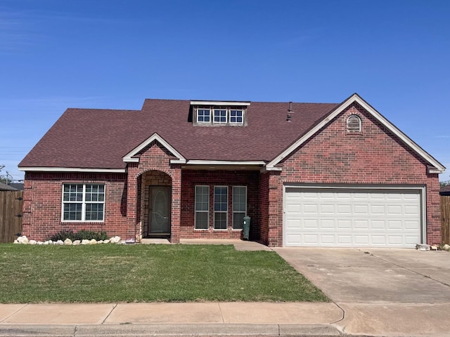 view of front facade with a garage and a front yard