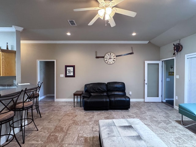 living room with lofted ceiling, crown molding, and ceiling fan