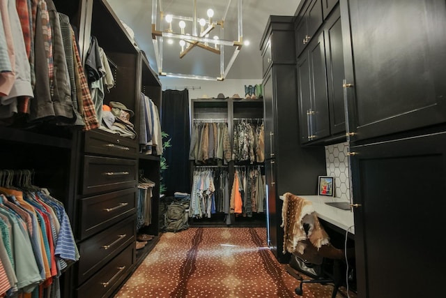 walk in closet with a notable chandelier