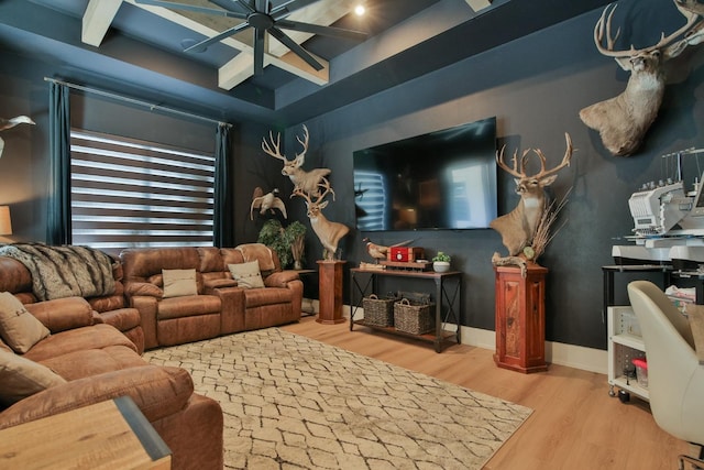 living room featuring ceiling fan and light hardwood / wood-style floors