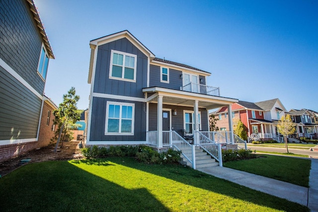 view of front of house featuring a front yard and covered porch