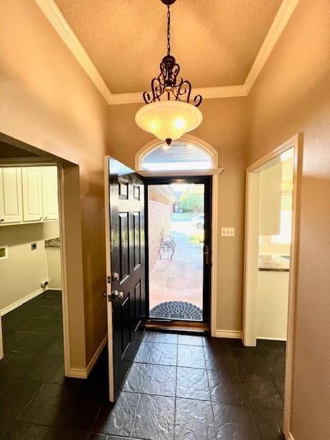 foyer entrance featuring crown molding