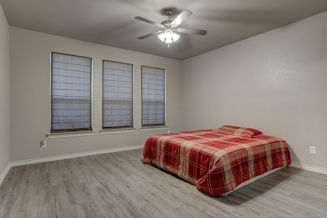 bedroom featuring ceiling fan and light wood-type flooring