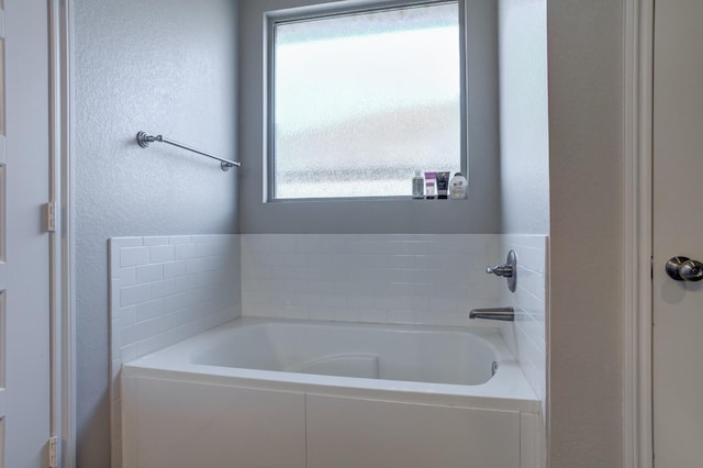 bathroom with a tub