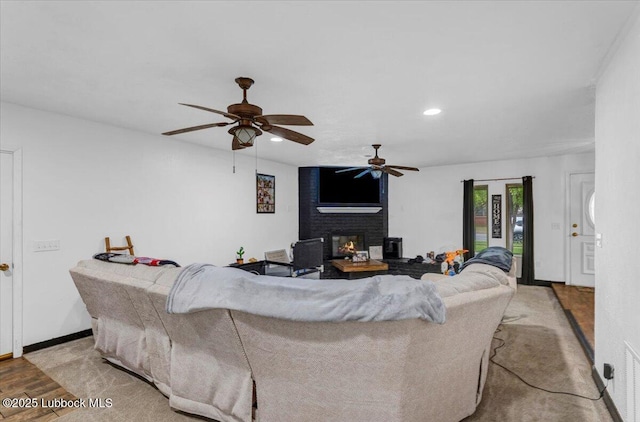 110 E 18th St, Littlefield, TX 79339 - living area with a ceiling fan, a fireplace, wood finished floors, and recessed lighting