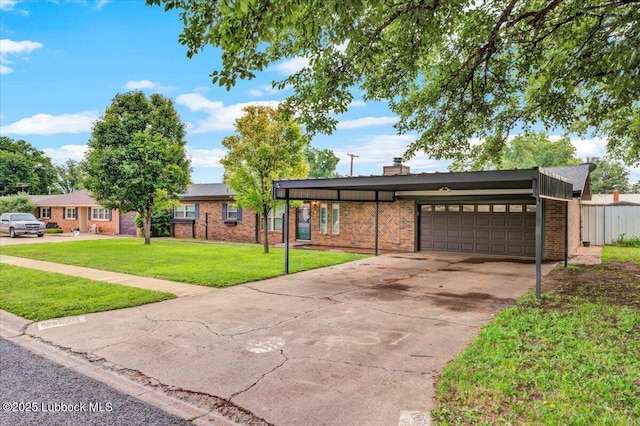 110 E 18th St, Littlefield, TX 79339 - view of front of house with an attached garage, brick siding, and concrete driveway