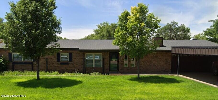 110 E 18th St, Littlefield, TX 79339 - ranch-style home with a front lawn, driveway, brick siding, a garage, and a chimney