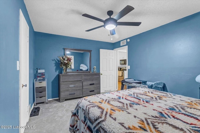 110 E 18th St, Littlefield, TX 79339 - bedroom featuring carpet, a textured ceiling, ceiling fan, and baseboards