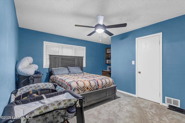 110 E 18th St, Littlefield, TX 79339 - carpeted bedroom with a textured ceiling, baseboards, and ceiling fan