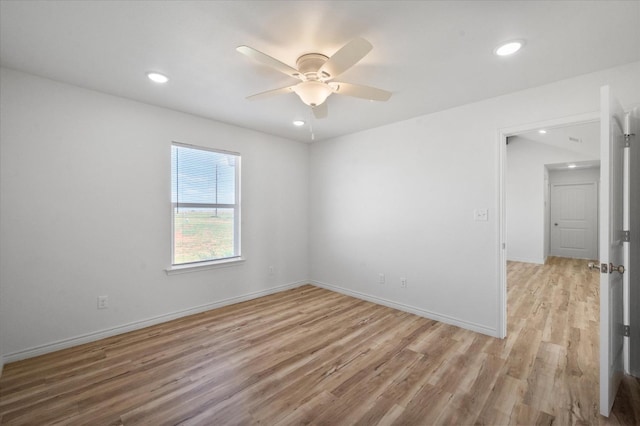 unfurnished room with ceiling fan and light hardwood / wood-style flooring