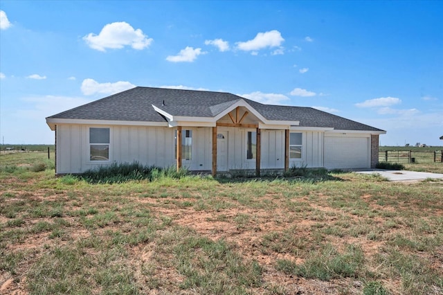 view of front of home with a garage and a front yard