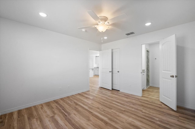 unfurnished bedroom with light hardwood / wood-style flooring and ceiling fan