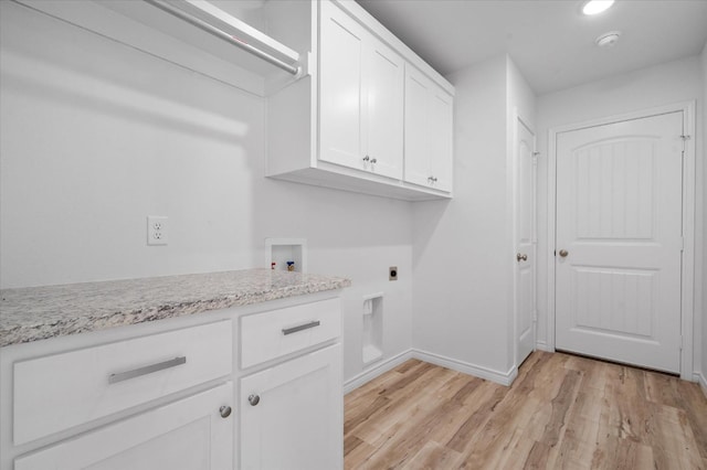 laundry area featuring cabinets, washer hookup, light wood-type flooring, and electric dryer hookup