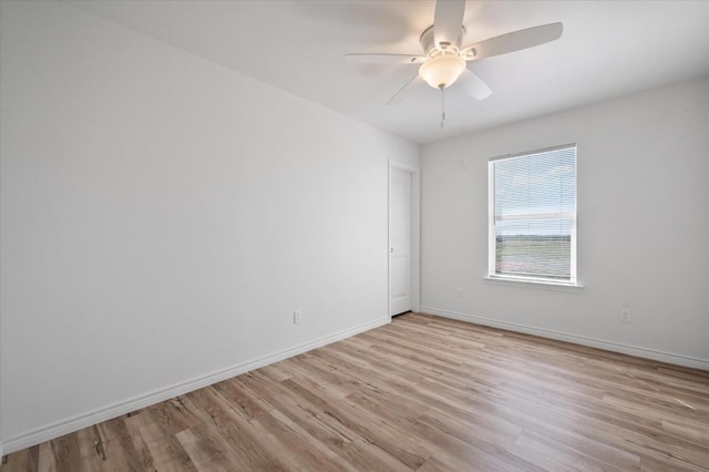 spare room featuring ceiling fan and light wood-type flooring