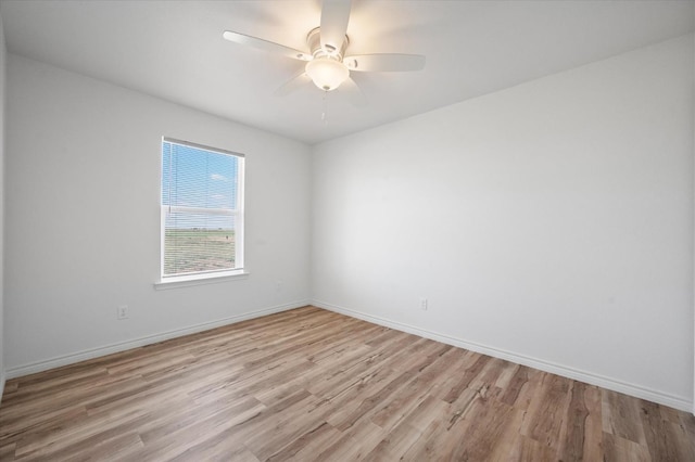 unfurnished room featuring ceiling fan and light hardwood / wood-style flooring