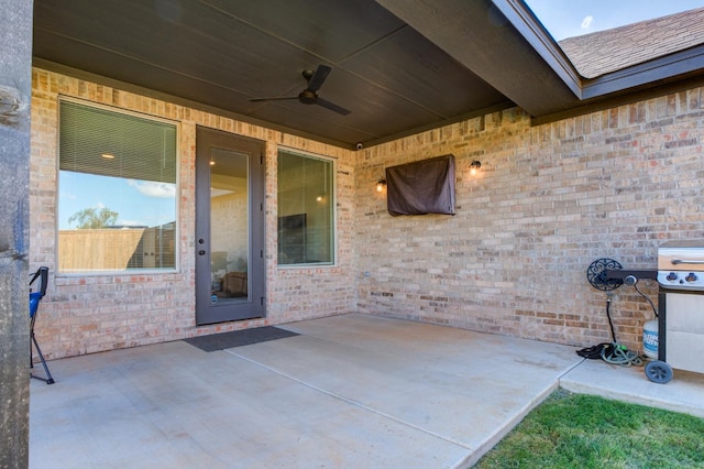 view of patio with ceiling fan and grilling area