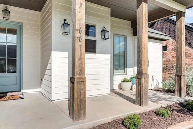 doorway to property featuring covered porch