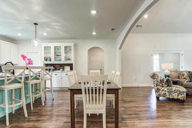 dining area with dark hardwood / wood-style flooring