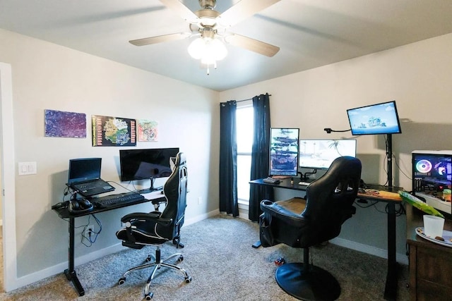 carpeted office featuring ceiling fan