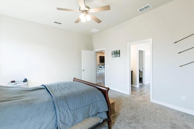 bedroom with light carpet and ceiling fan