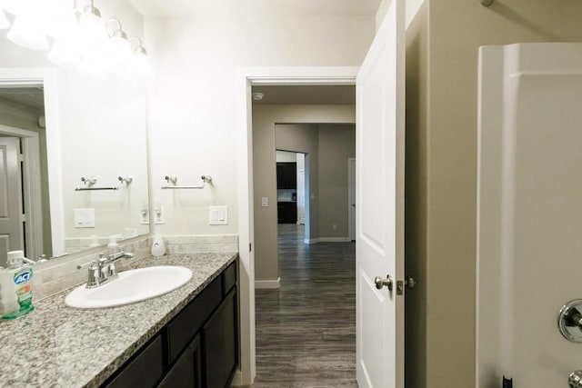 bathroom with vanity and wood-type flooring