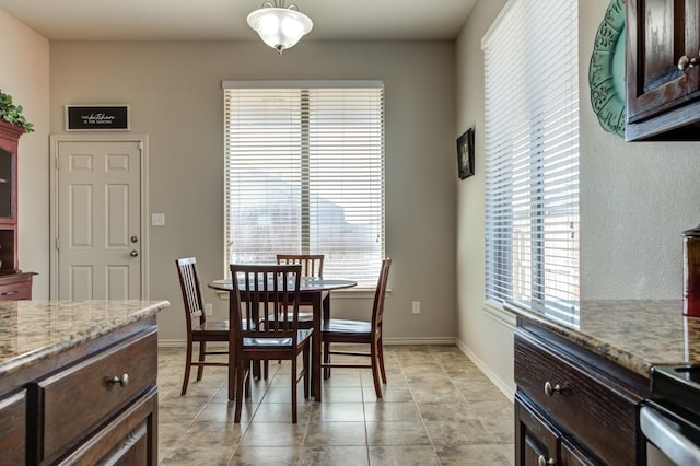 dining space featuring light tile patterned floors