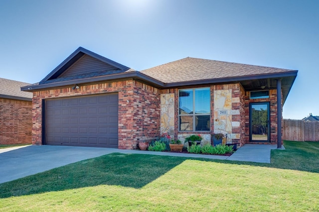 view of front of home featuring a garage and a front lawn