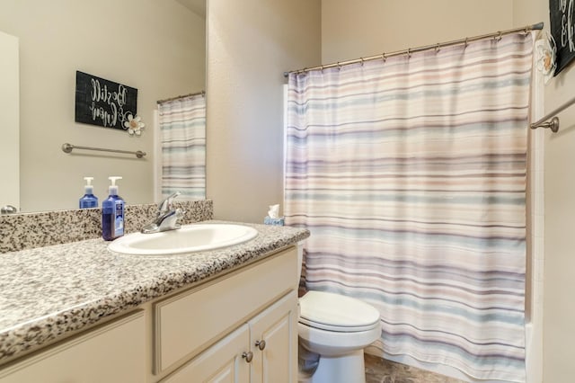 bathroom featuring vanity, a shower with curtain, and toilet