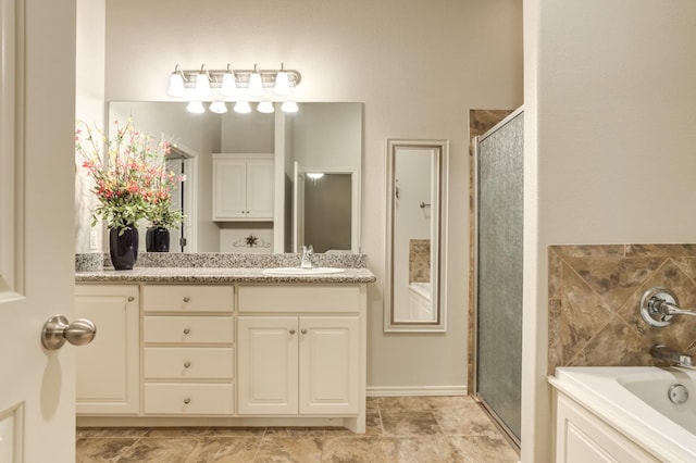 bathroom with vanity and separate shower and tub