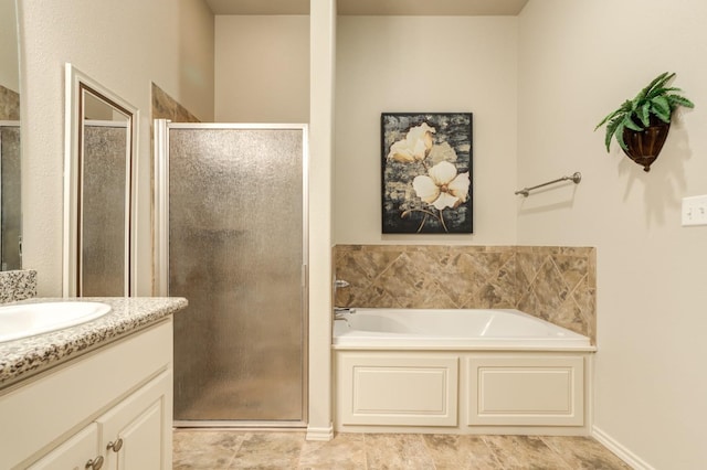 bathroom featuring tile patterned floors, vanity, and shower with separate bathtub