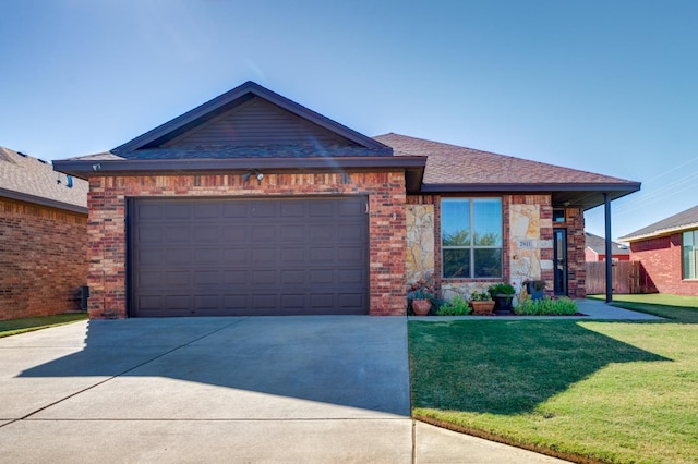 view of front of home featuring a garage and a front yard