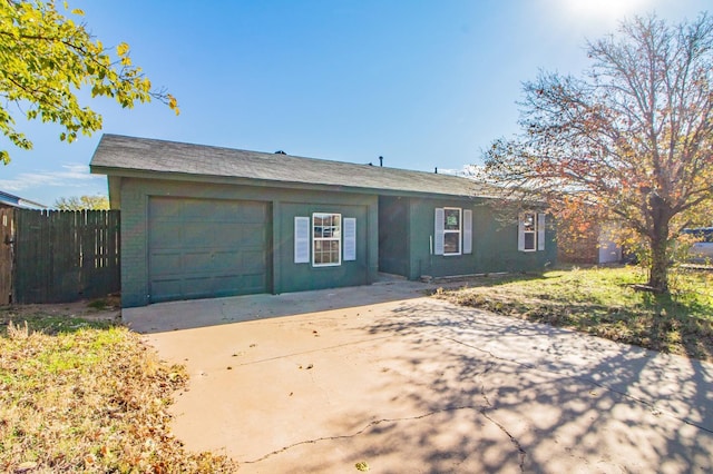 ranch-style house with a garage and a front lawn